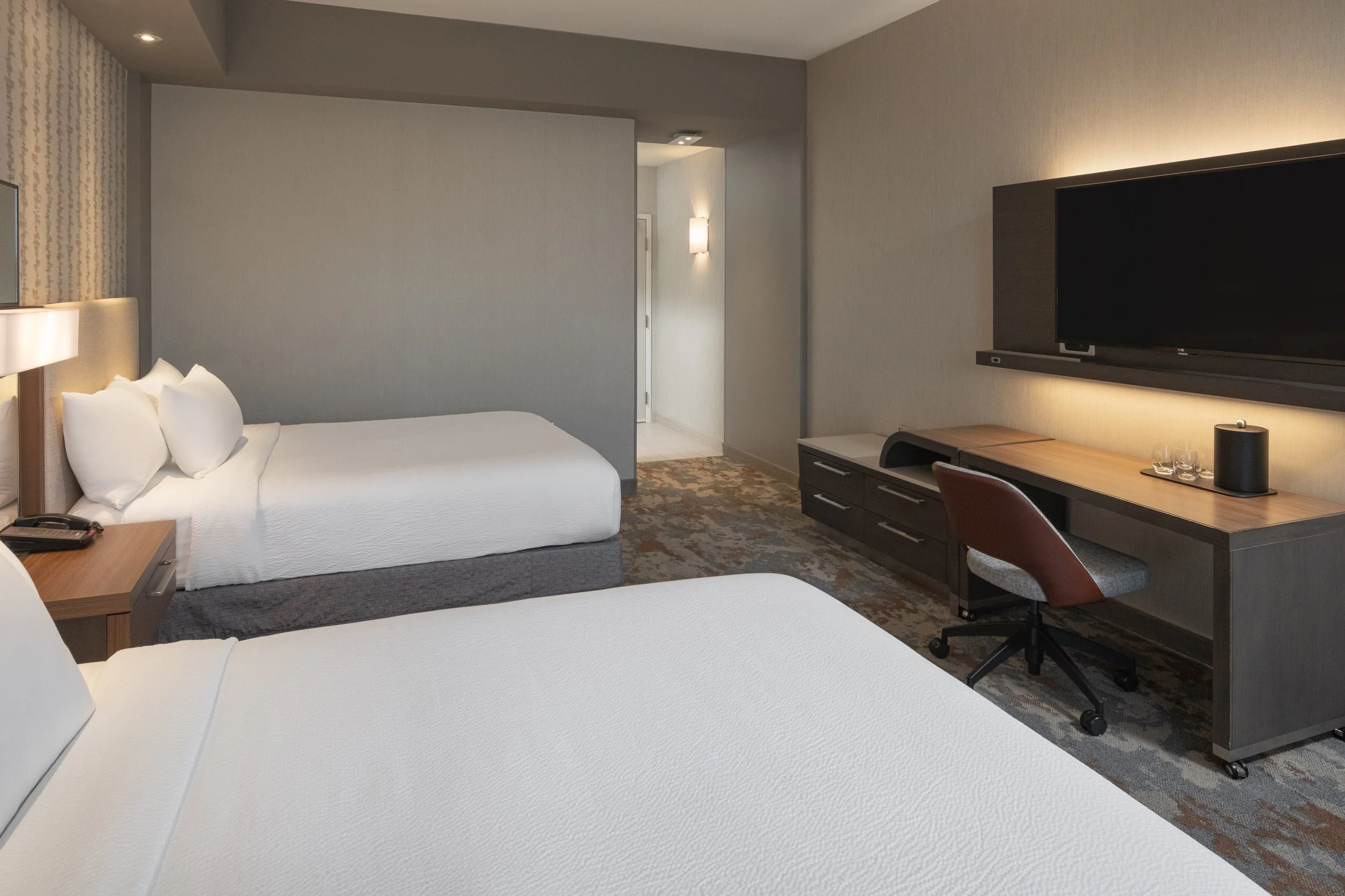  ORIGINAL FILENAME:  4932_TYSCP_Courtyard_zxsz_door.jpg  FILE NAME:  Guest Room  PHOTO PLACEMENT TAG:  Search in DAC for: Guest Rooms  CAPTION:  Guest Room Living Area  MARKETING CAPTION:  The reverse living-area angle shows sofa seating, a work desk