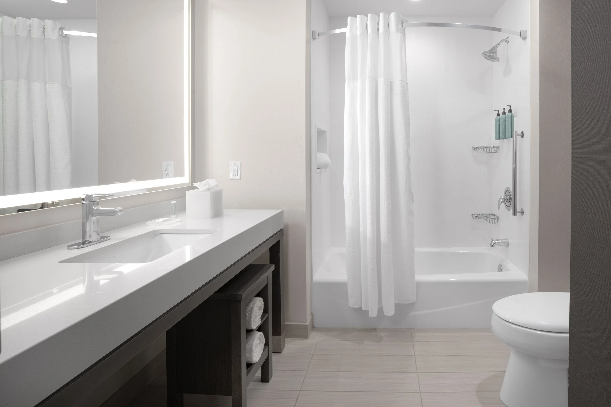  ORIGINAL FILENAME:  4938_TYSCP_Courtyard_room_tubshower.jpg  FILE NAME:  Bathroom  PHOTO PLACEMENT TAG:  Search in DAC for: Guest Rooms  CAPTION:  Guest Bathroom – Tub/Shower  MARKETING CAPTION:  The guest bathroom photo shows a vanity, illuminated 