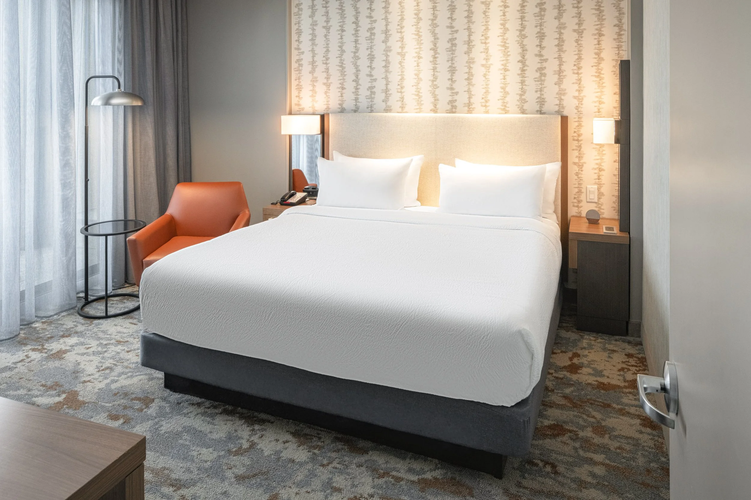  ORIGINAL FILENAME:  4941_TYSCP_Courtyard_kste_bedroom.jpg  FILE NAME:  Suite  PHOTO PLACEMENT TAG:  Search in DAC for: Suites  CAPTION:  King Suite Bedroom  MARKETING CAPTION:  The King Suite bedroom view shows a bed, bedside lighting, accent seatin