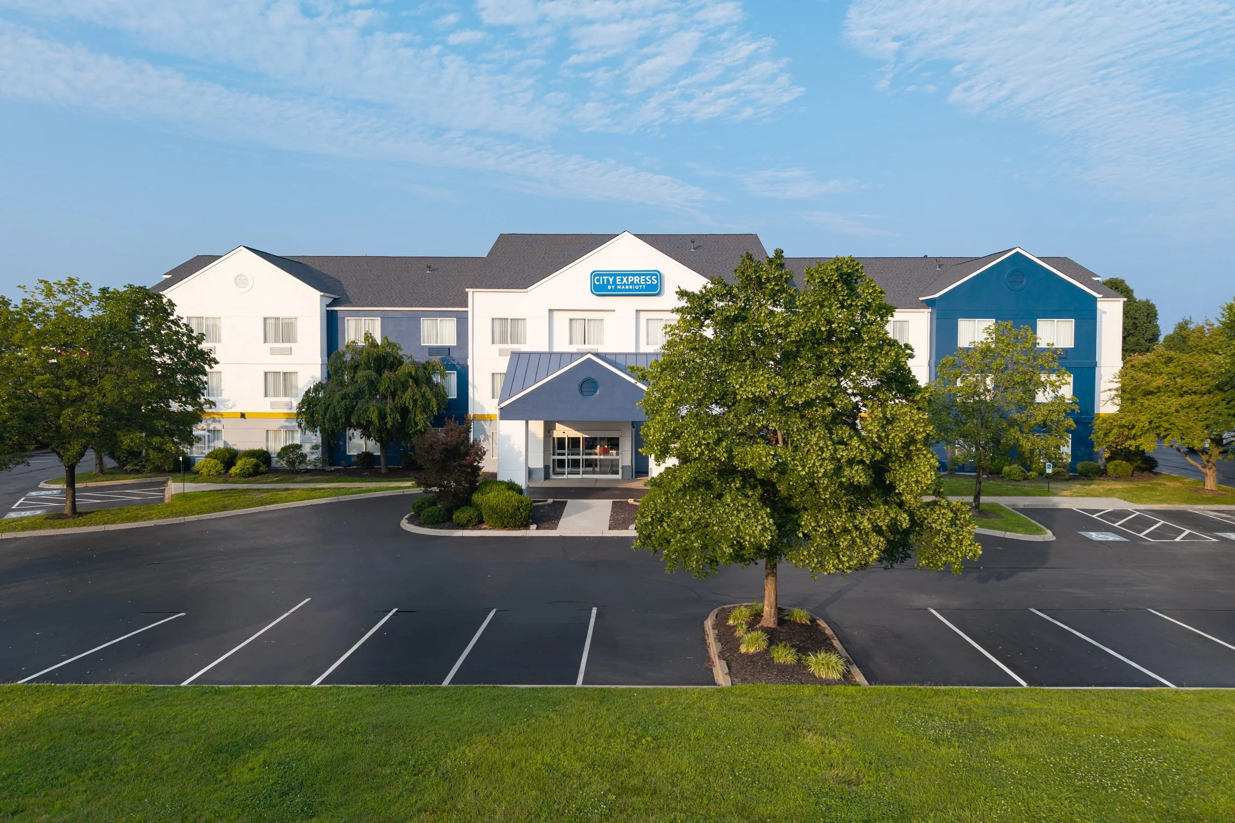  FILE NAME  Exterior  CAPTION  Daytime Exterior  ALT TAG / LOGO DESCRIPTION  Exterior with entrance, facade, and parking  GUEST ROOM OR ADD-ON / NRP?  N / A  HAVE PRODUCT ID?  No  IS THIS AN ANCILLARY PRODUCT?  No  ADD TO HWS PHOTO GALLERY SECTION  H