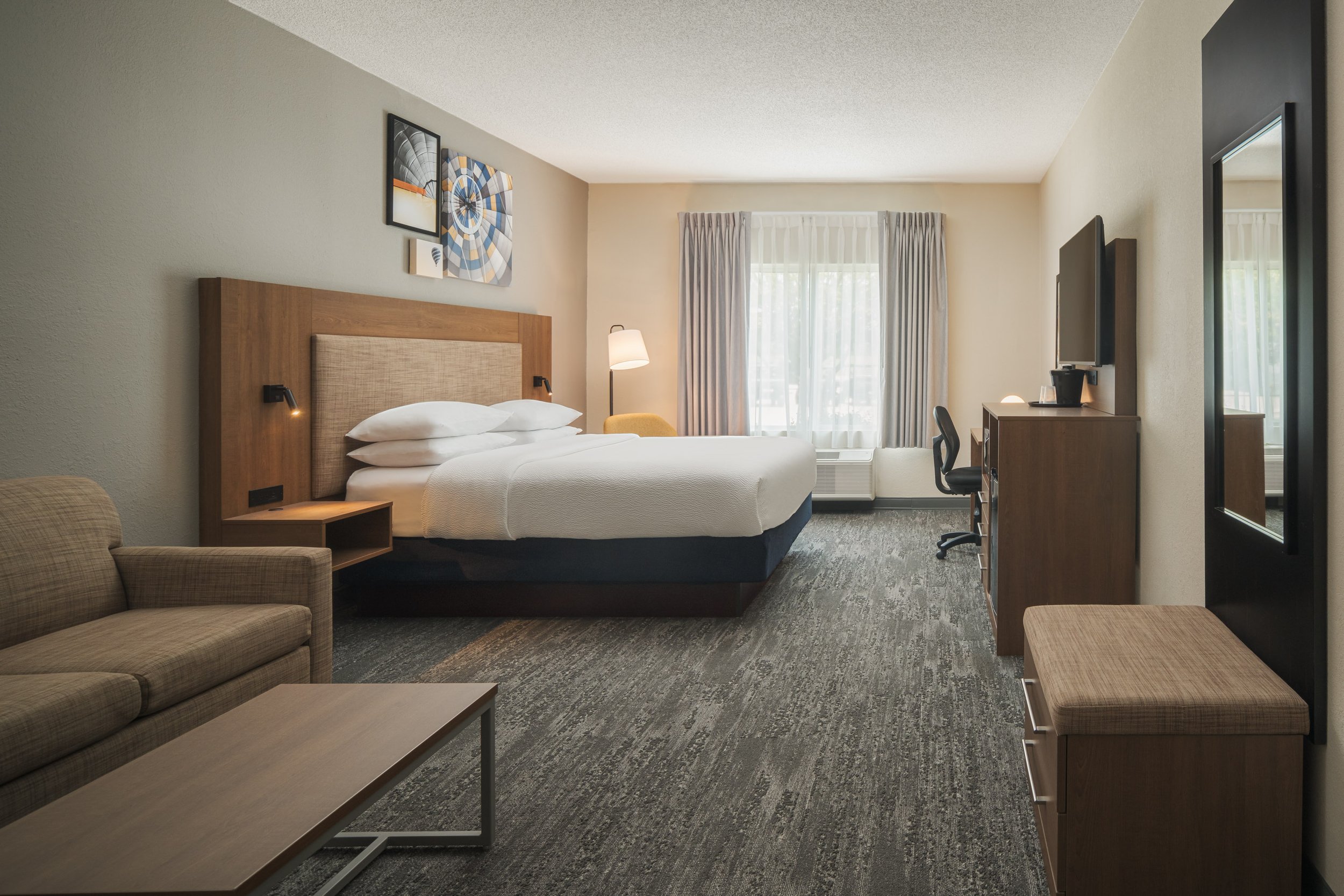  FILE NAME  Suite  CAPTION  King Suite  ALT TAG / LOGO DESCRIPTION  King bed with sofa, desk, and TV  GUEST ROOM OR ADD-ON / NRP?  Sleeping Room / SR  INVENTORY TYPE CODE  Property to enter inventory type code if required.  HAVE PRODUCT ID?  No  IS T