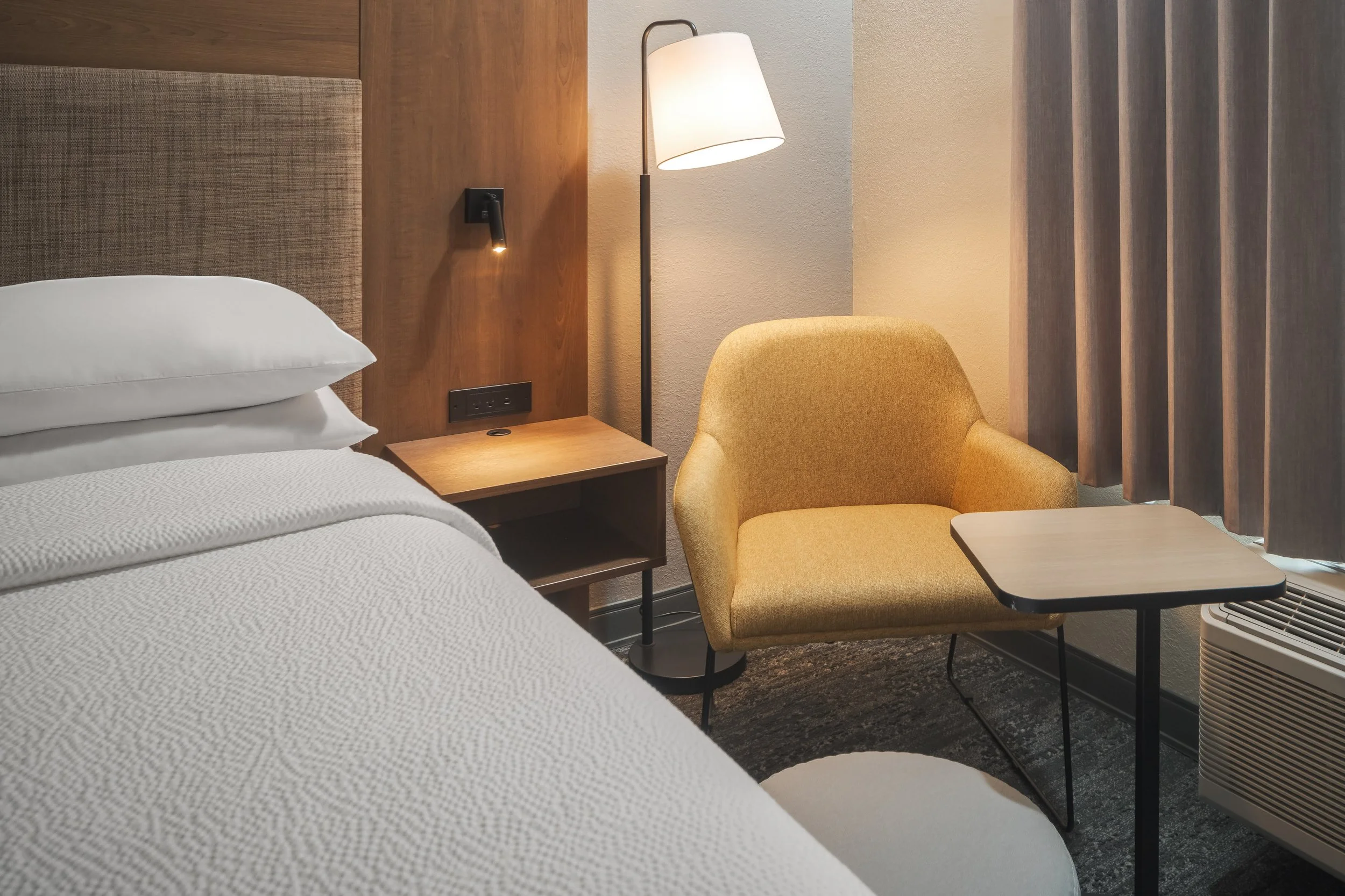  FILE NAME  Seating Area  CAPTION  Guest Room Seating  ALT TAG / LOGO DESCRIPTION  Guest room chair with side table and reading lamp  GUEST ROOM OR ADD-ON / NRP?  Sleeping Room / SR  INVENTORY TYPE CODE  Property to enter inventory type code if requi