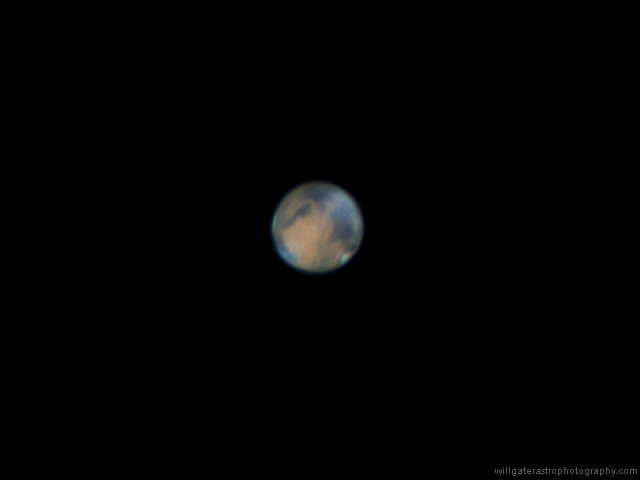 Mars showing albedo features, clouds and the north polar ice cap, 16 April 2014