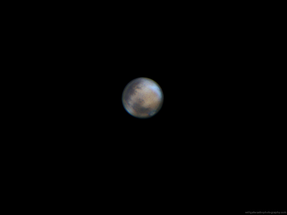 Mars showing albedo features, clouds and the north polar ice cap, 10 April 2014