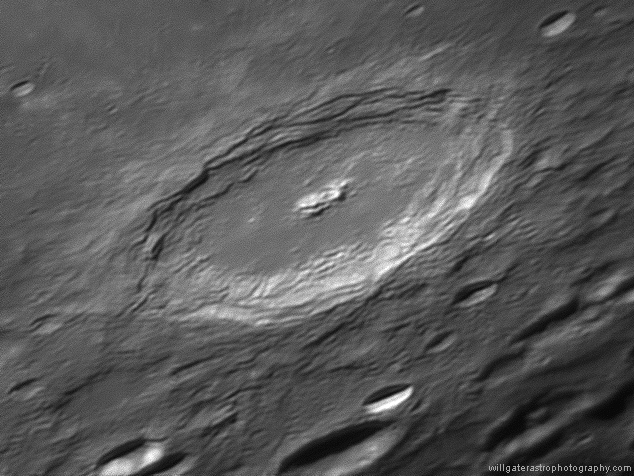 Crater Langrenus showing the pronounced central peak mountains and uneven crater floor
