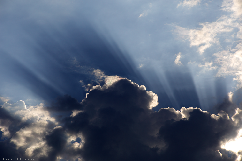 Crepuscular rays over summer clouds