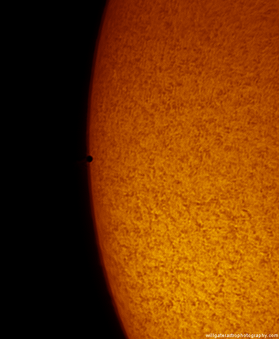 Mercury edges onto the solar disc in hydrogen-alpha light during the transit of 9 May 2016