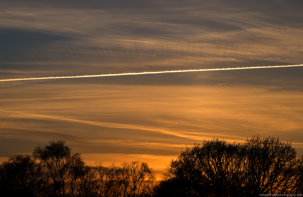 Crepuscular rays from a contrail