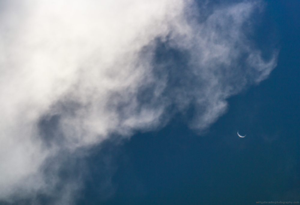 The shimmering crescent Venus peeking out from behind clouds - 22 March 2017