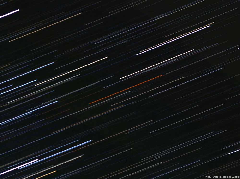 The conspicuous orange-red colour of carbon star W Orionis as seen in a 'star trail' image