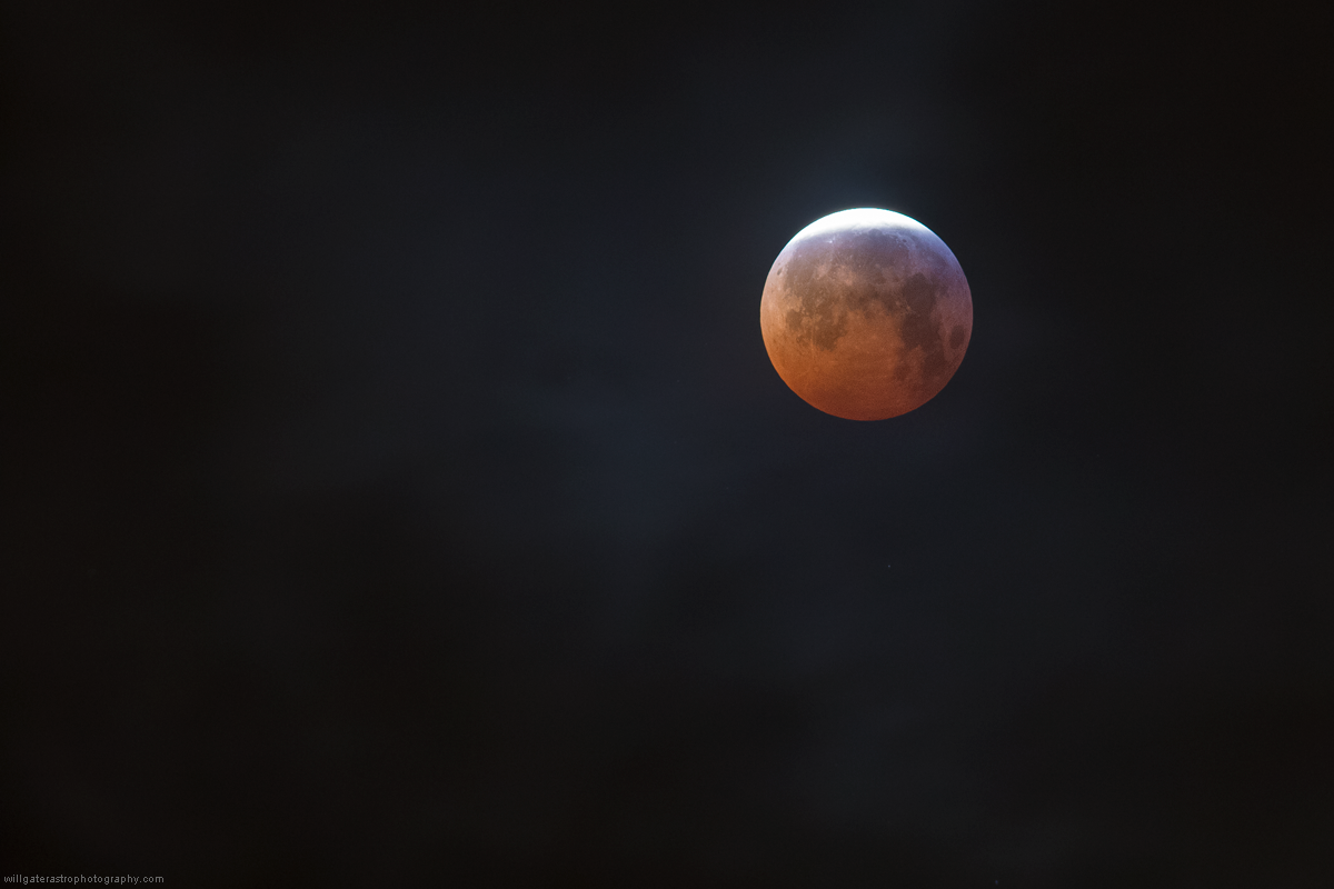 The full Moon emerging from totality as clouds pass by during the 21 January 2019 total lunar eclipse.