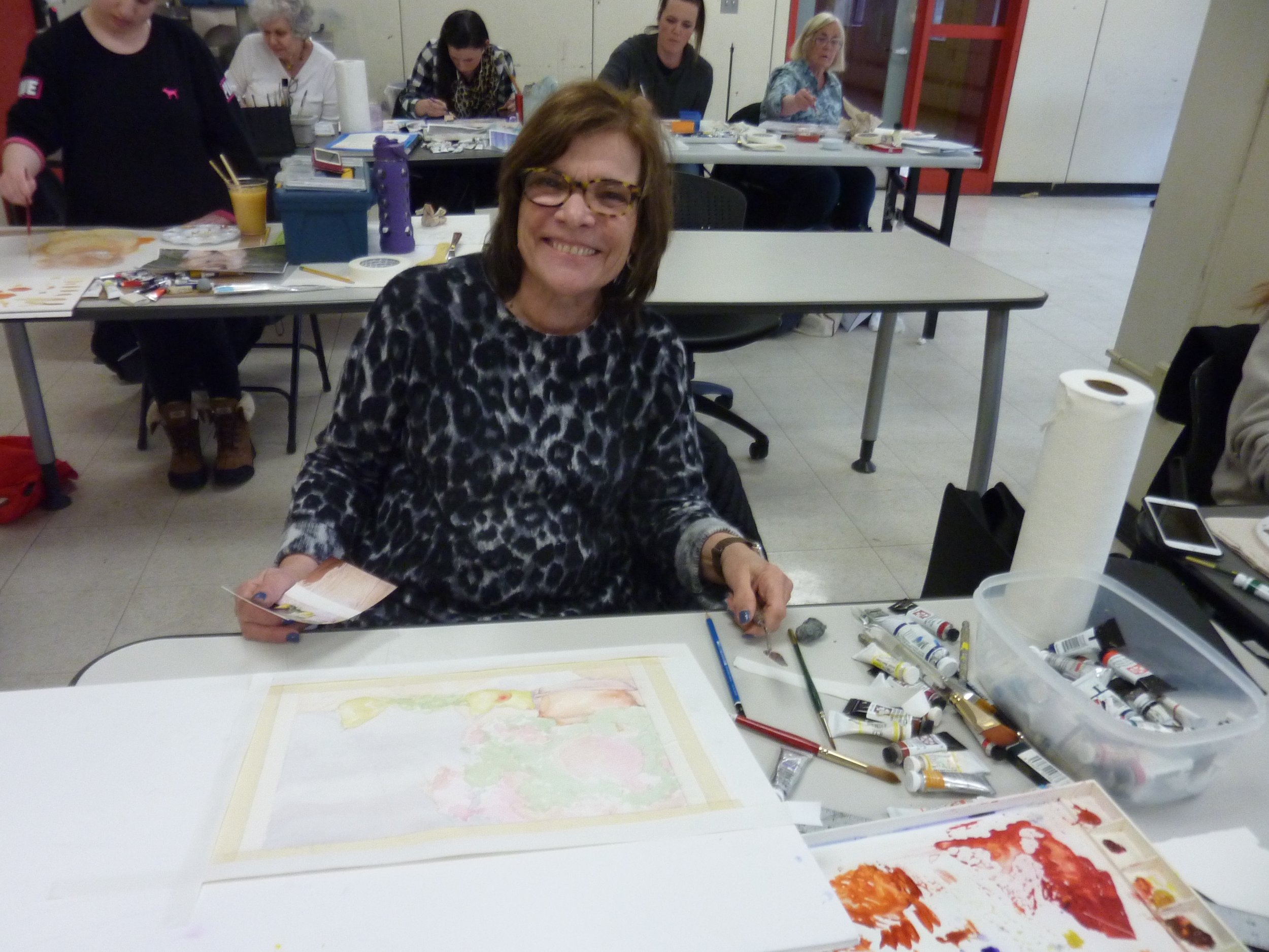 Joan brought a watercolor painting she'd already begun, and realized how many detailed layers were involved in creating the flowers, grapes and fruit.