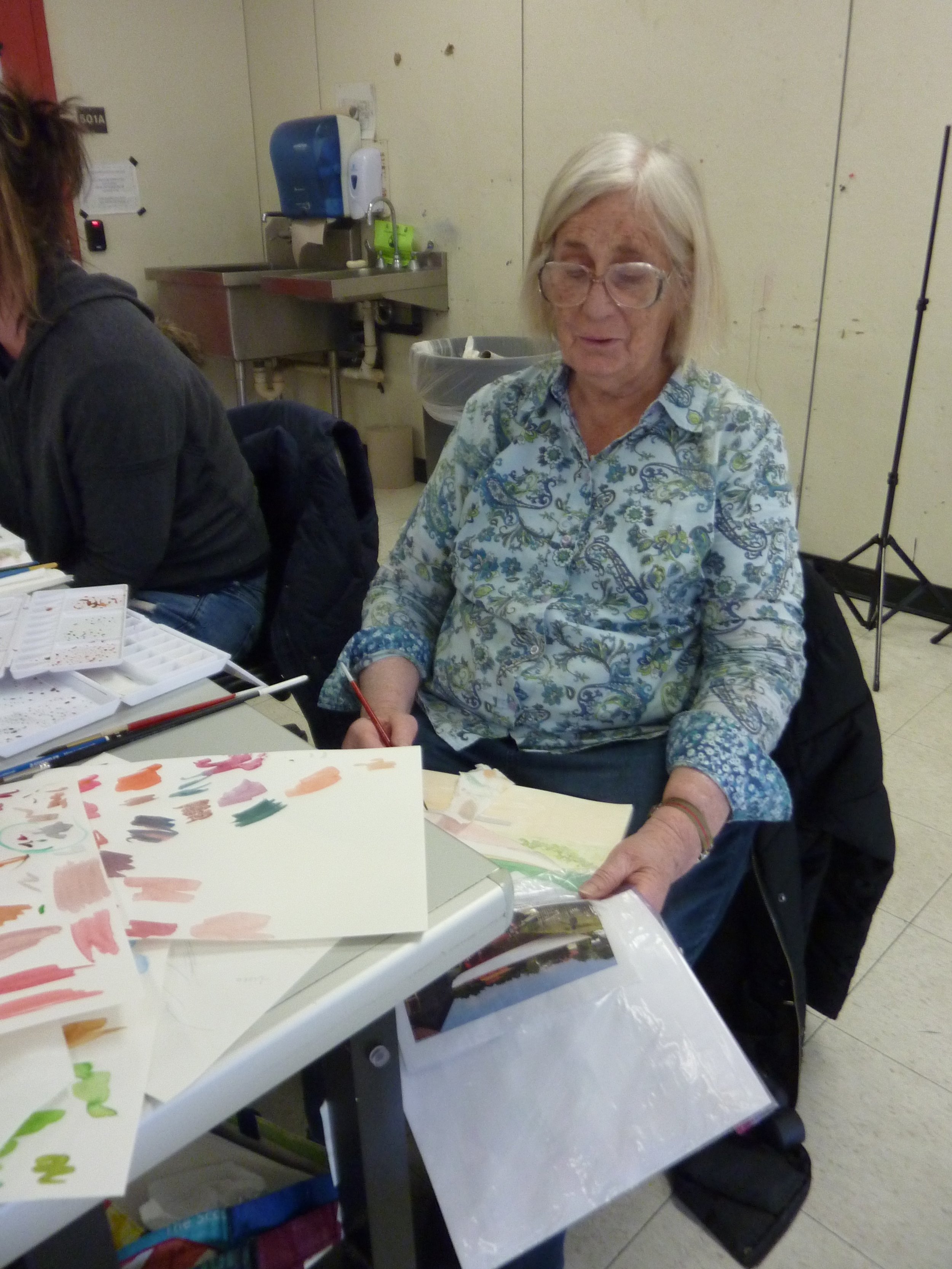 Debbie worked on a boat by a barn, diligently trying to get colors that were true.
