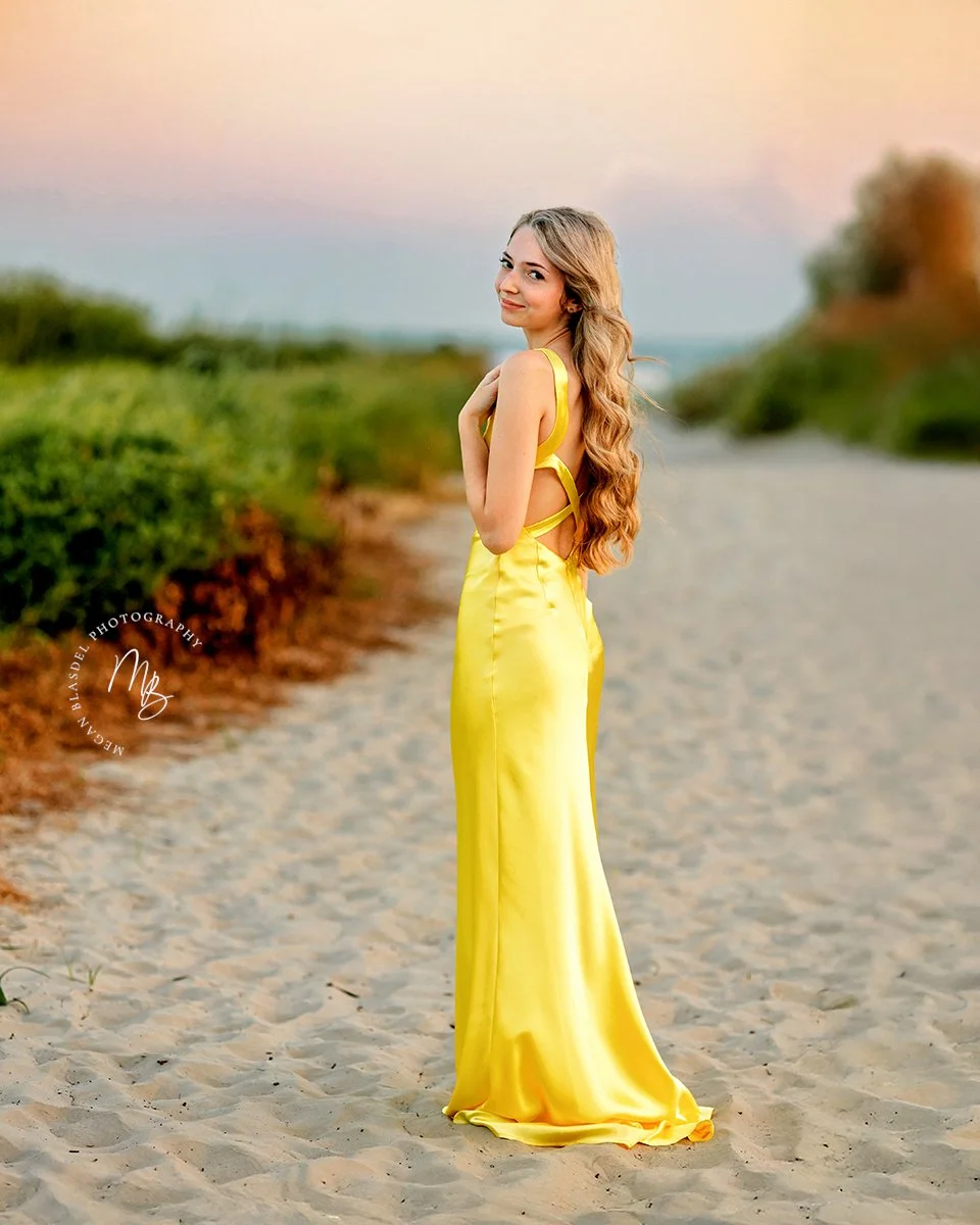  Teenager in yello dress during a Galveston, TX beach session with Megan Blasdel Photography 