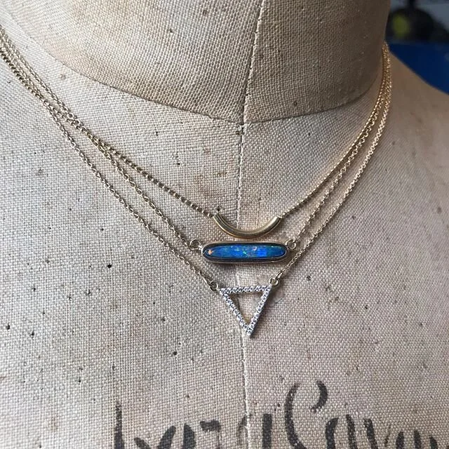 Love to layer! Curved tube, Australian opal, diamond triangle. All in 14k yellow gold. .
#layerednecklaces #sr66sf #instajewelry #blueopal #handmadejewelry