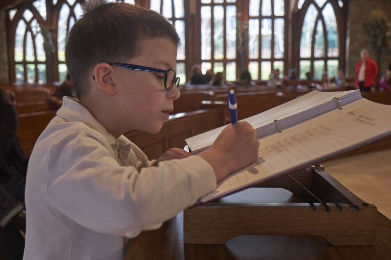 Kevin signs the book of the elect with his own hand.