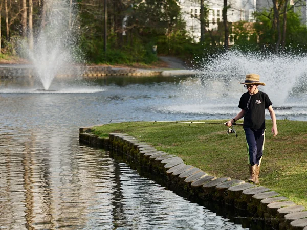 Walking his line down to lure the fish in...