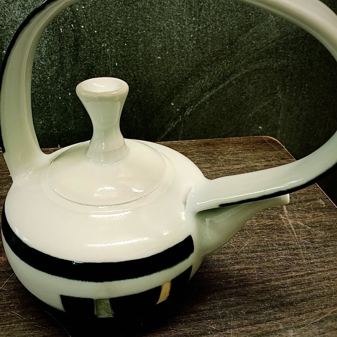 Clay is always humbling and sometimes heartbreaking... but important for others to see faults along with successes. This handle was an upright arch pre-firing. Cone 10 porcelain.