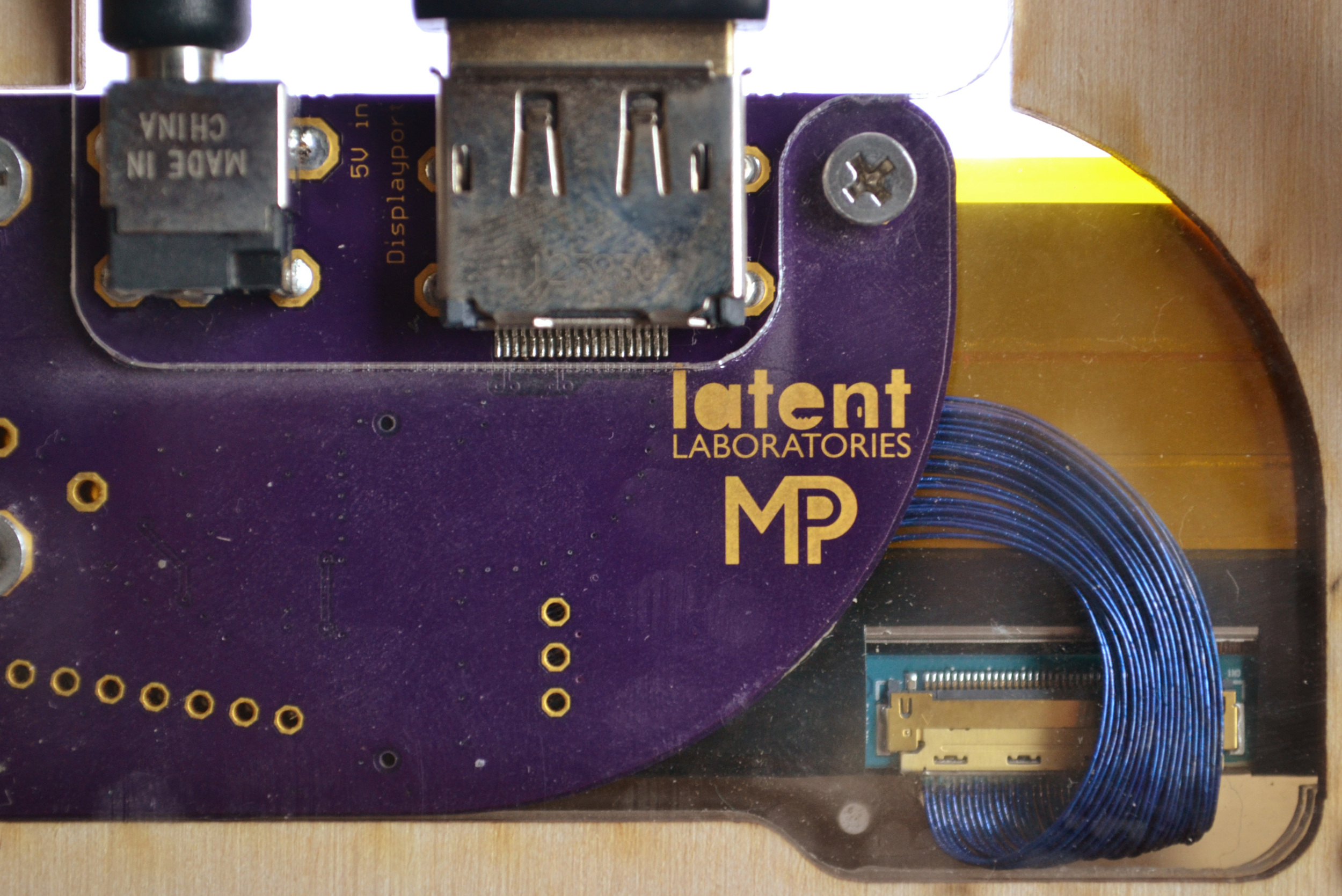 LCD cable, bent to reach new connector position.