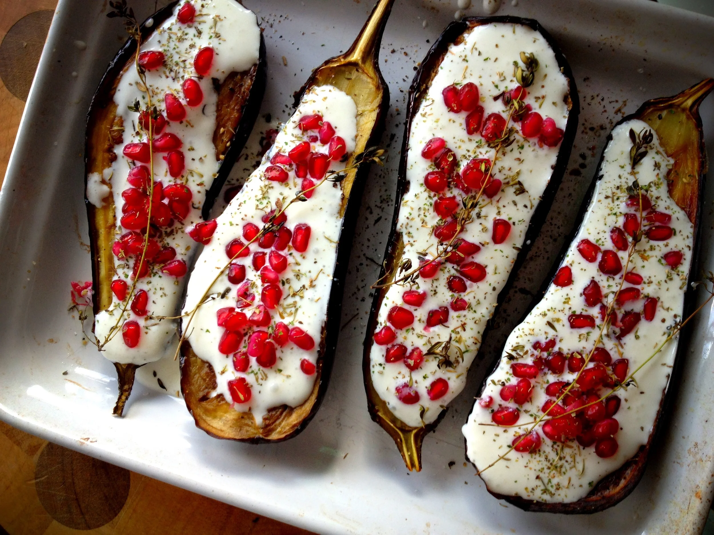 Roast aubergines with buttermilk dressing and pomegranate seeds