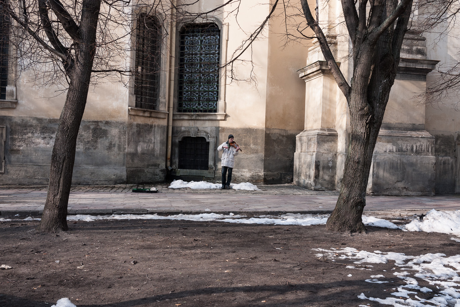  A man plays the violin outside the Dominican Greek Catholic church in Lviv, west Ukraine. The west of the country is home to the majority of the country's Catholic believers. 