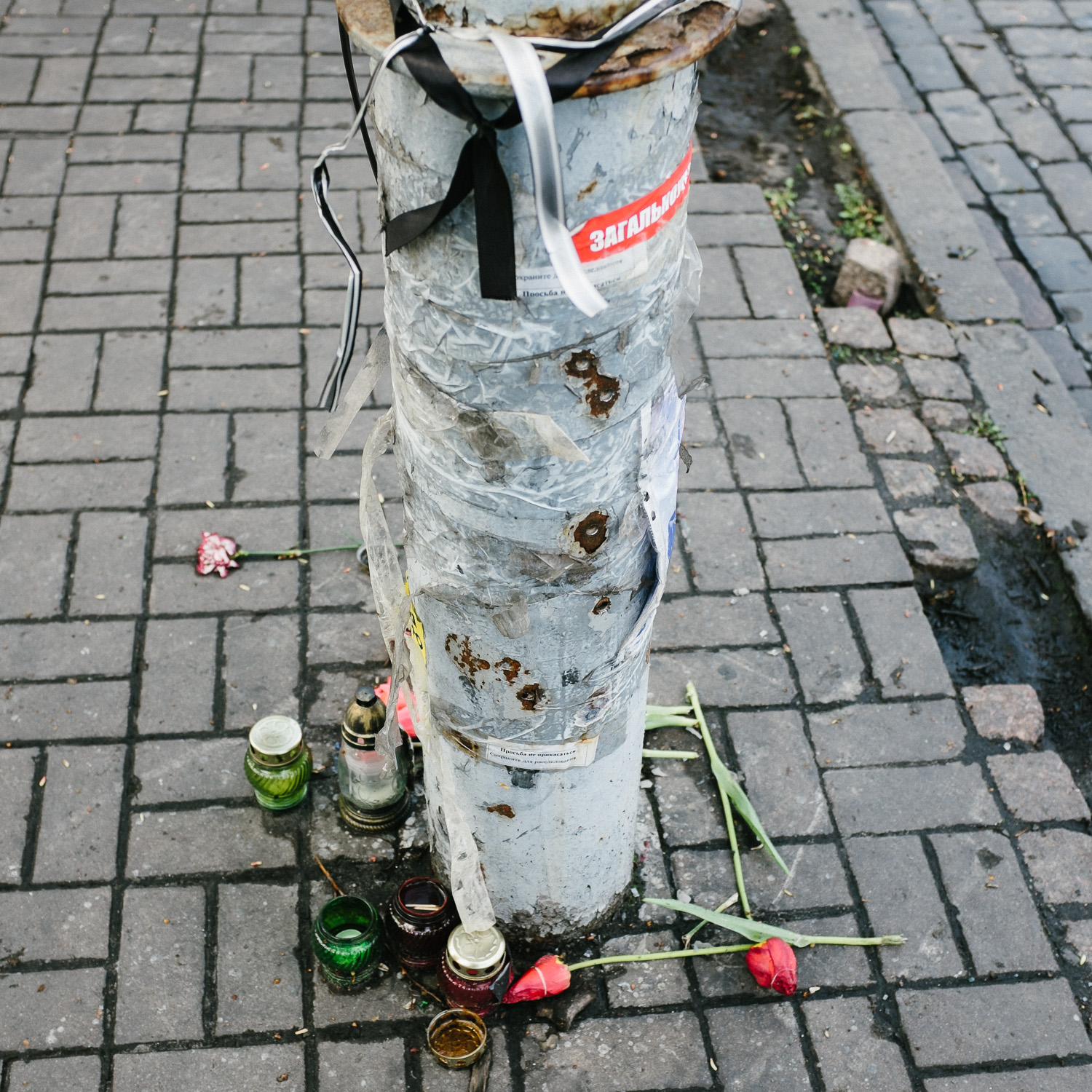  Bullet holes mark a lamppost on Kyiv's Hrushevskoho Street, off Independence Square. 
