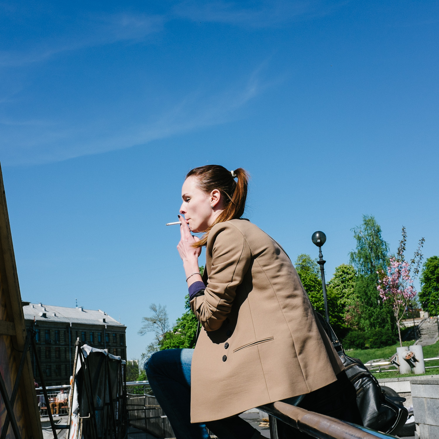  A woman smokes overlooking Kyiv's Independence Square. 