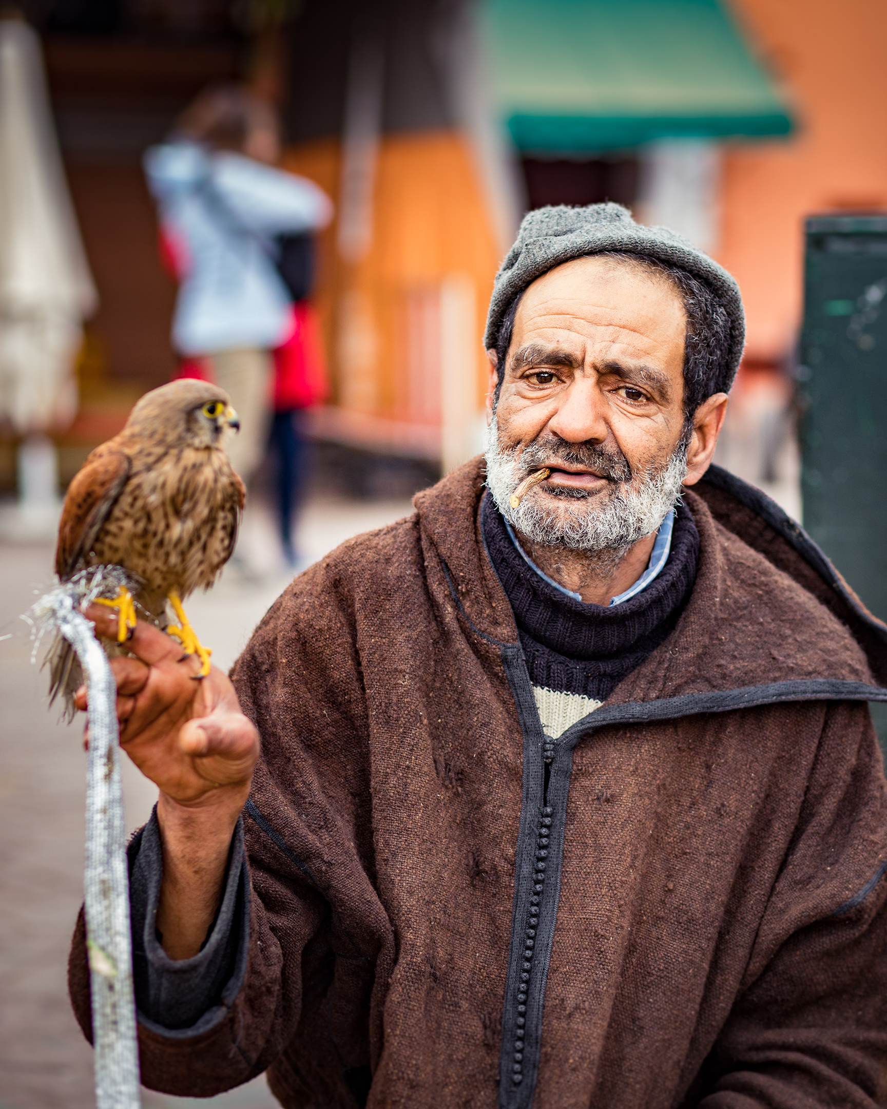  Local man posing for photos with his bird, for tips only of course. 