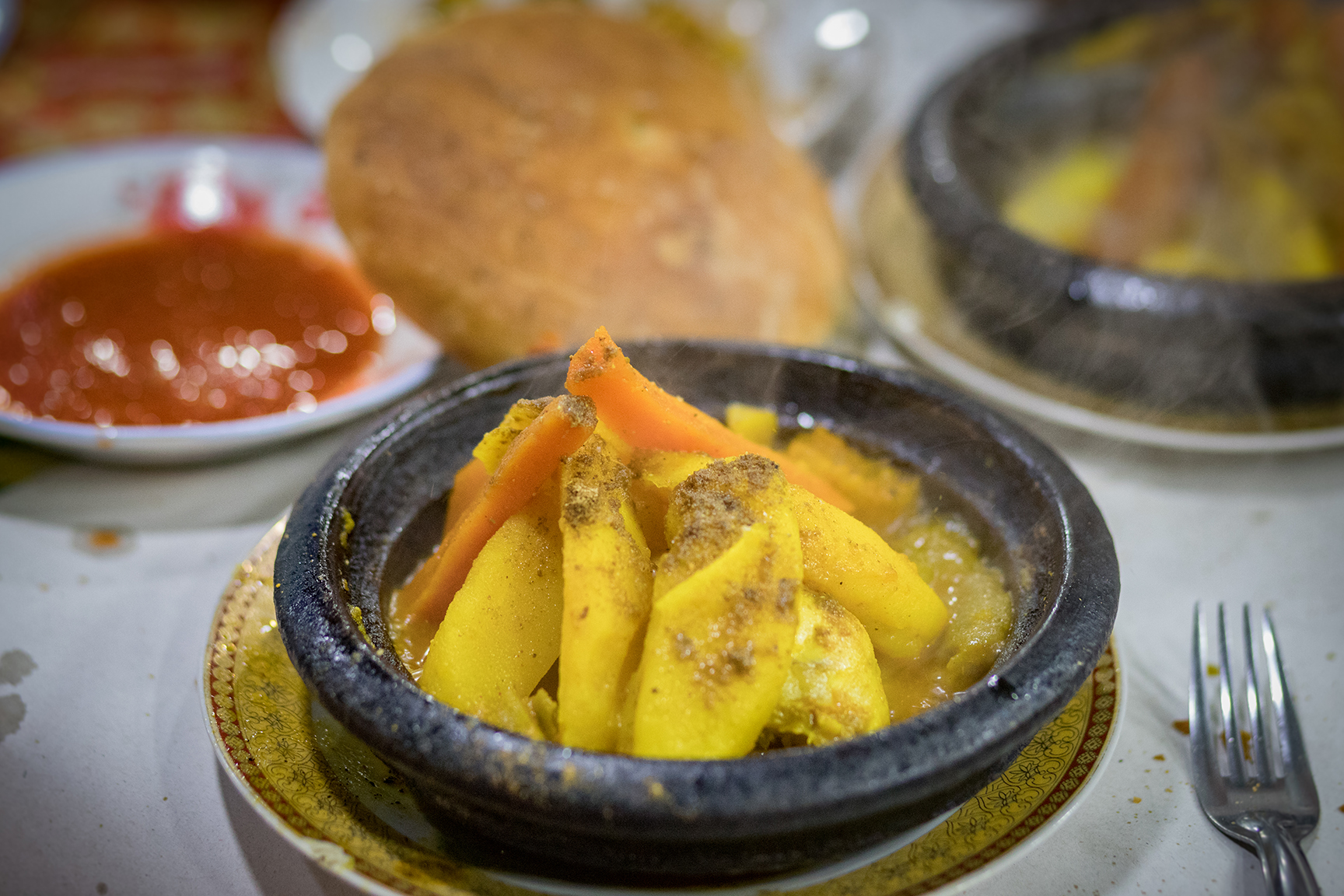 Tajine - A Morrocan dish cooked & served in a clay pot with a variety of ingredients. This one was potatoes, carrots & chicken with various spices.