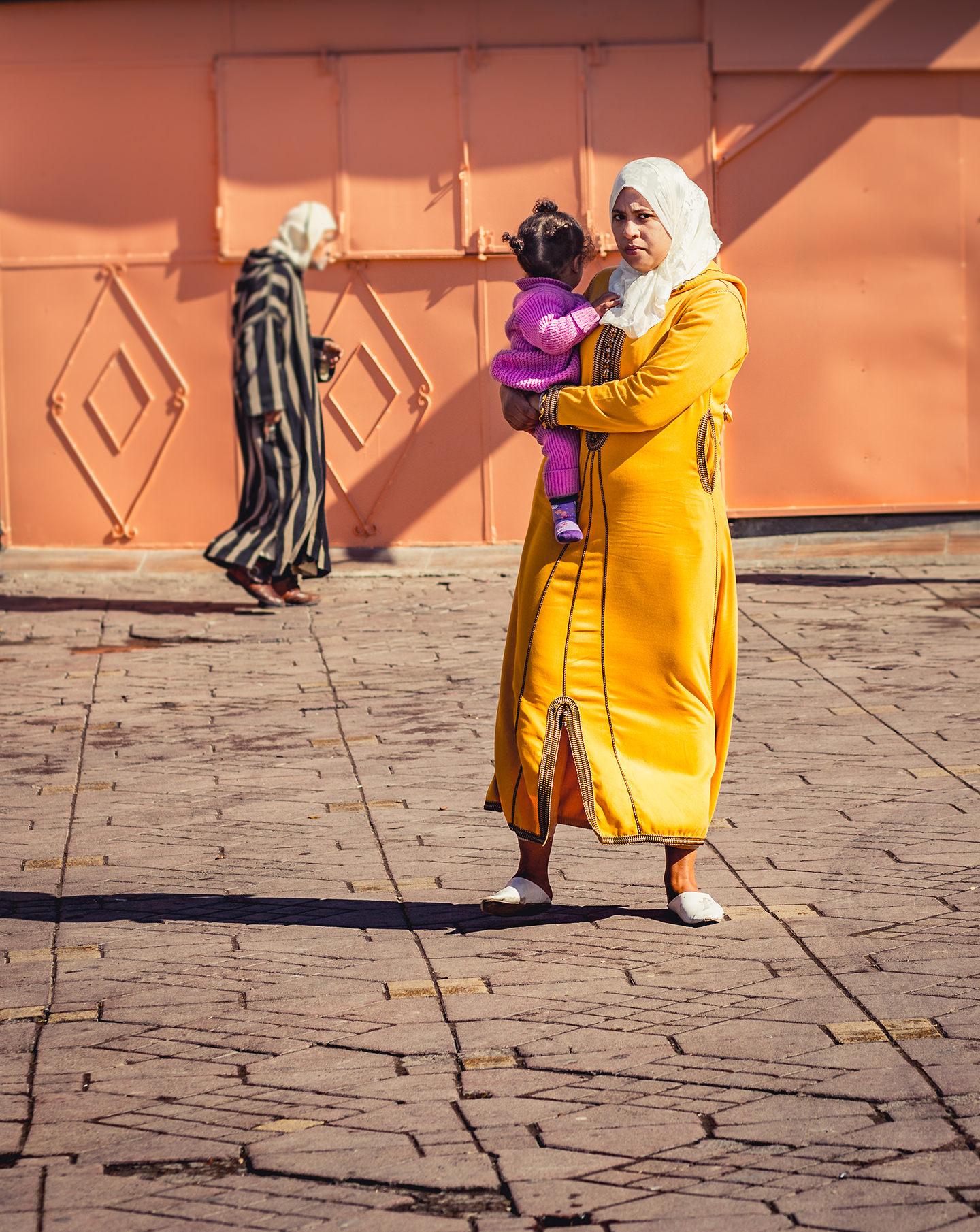 Candid photo of local woman in colorful garb.