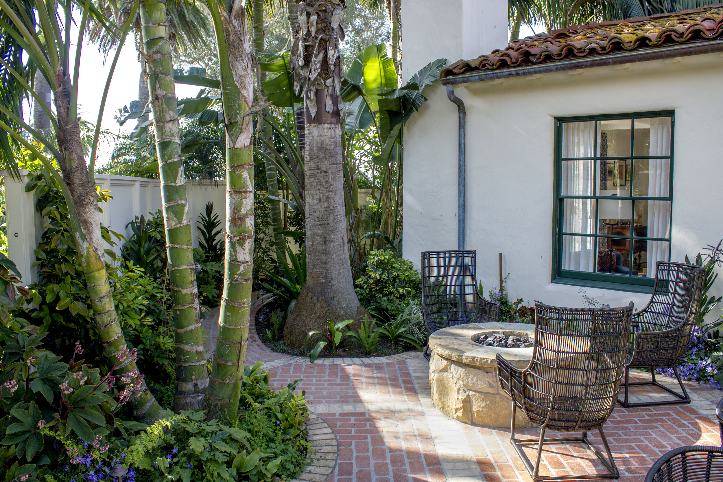 Gathering around the fire pit is almost instinctual for people. This patio offers a raised fire pit with comfortable surrounding seating available. The fire pit is also protected on all sides either from the building or walls, greatly reducing unwelcome night breezes.