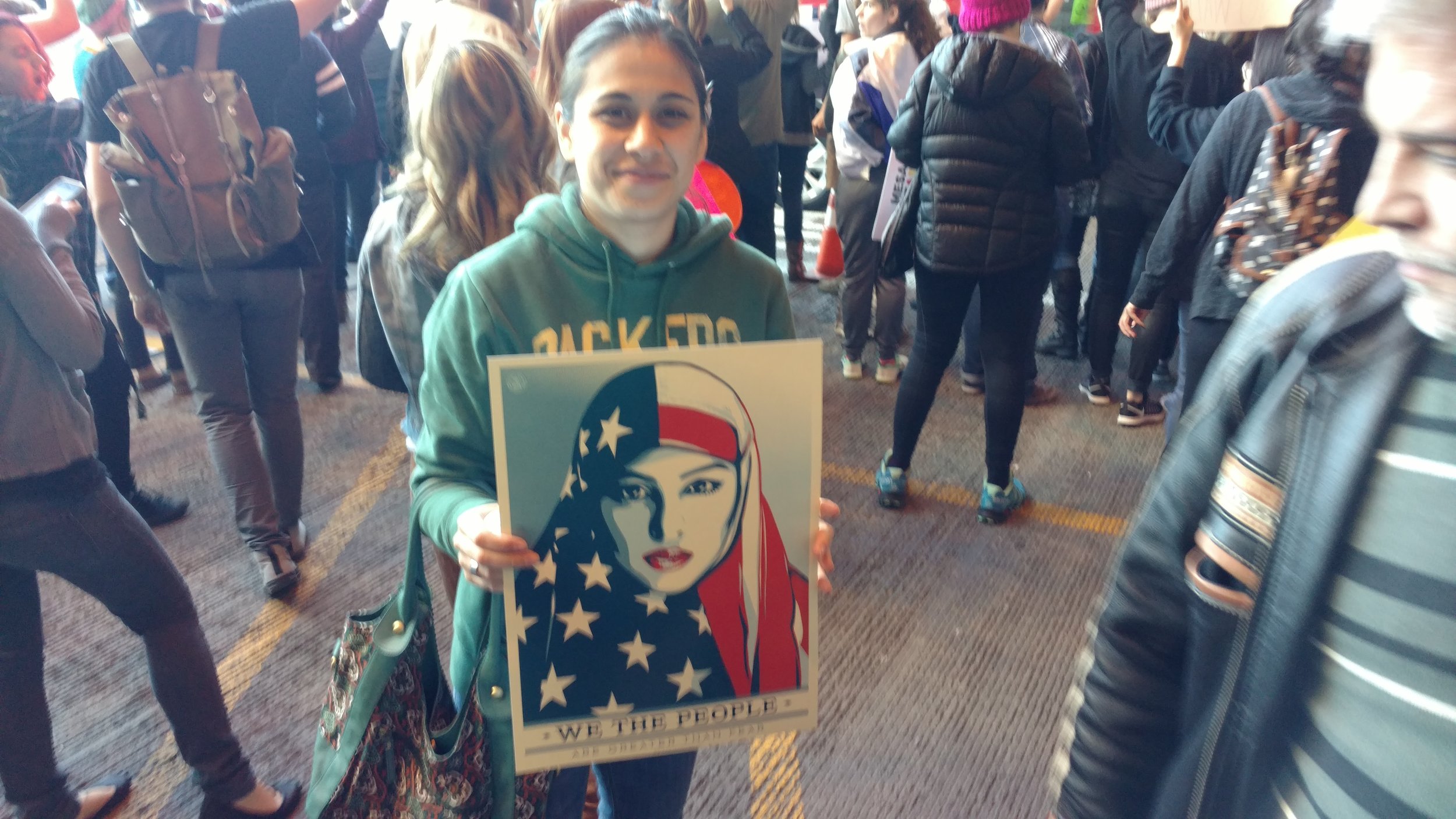 One of the many protesters and images of the PHX protest to Trump's immigration ban. 