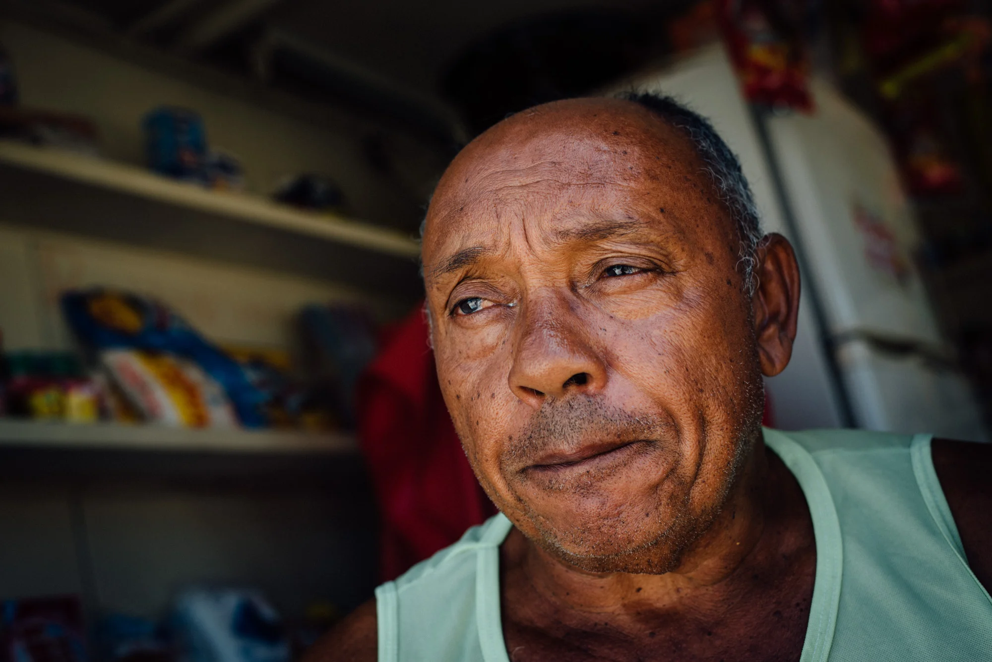 Cicero dos Santos, 64, talks about his life. Dos Santos says it's been hard adapting to life in rural Paraiba state after moving from Sao Paulo only one month ago to be with his girlfriend. Dos Santos manages a small shop where he sells everything from potato chips to batteries to keys.