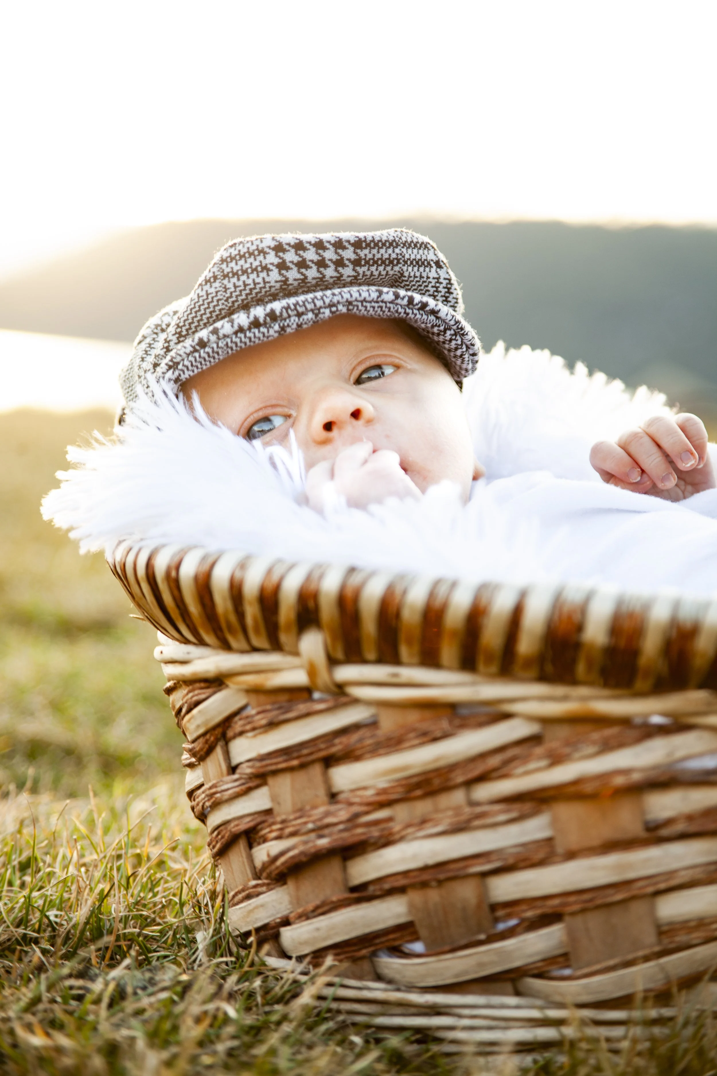 Newborn baby photographed near Reno NV with Lake Tahoe background.