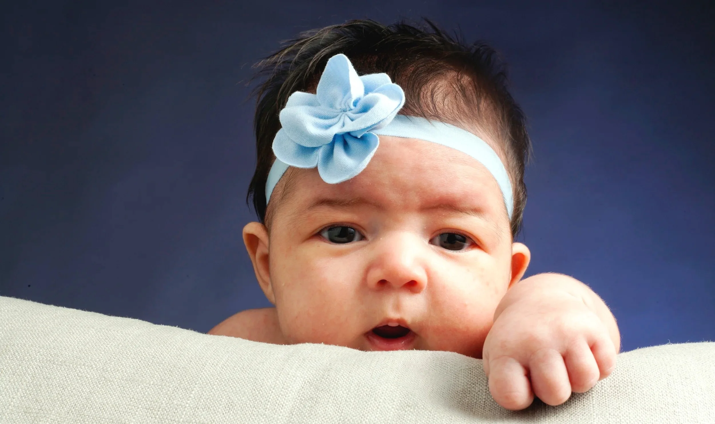 Newborn baby studio portrait in Reno, NV and Lake Tahoe with soft lighting.