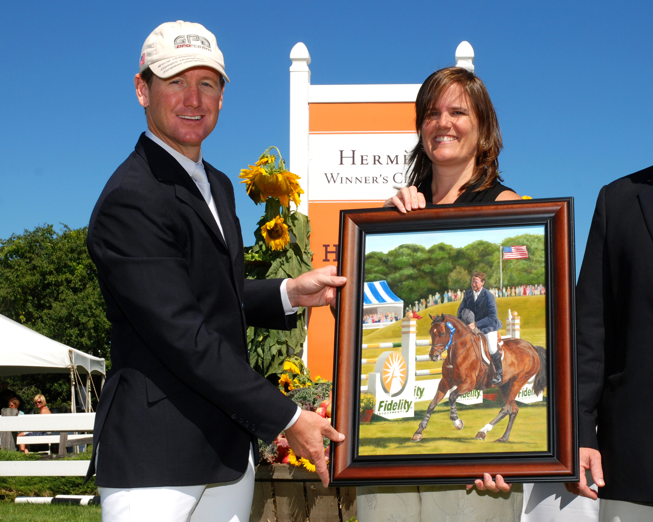 Gretchen presenting Gold Medalist Mclain Ward the painting she did of him on Goldika for the Fidelity Investments Jumper Classic, Hampton Falls, NH 2010.