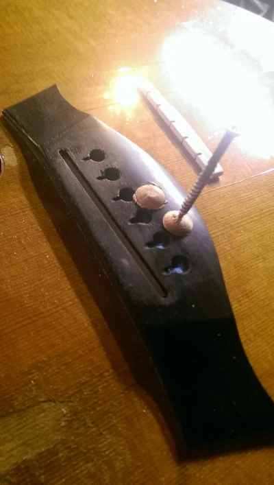 A couple of the plugs with my custom made applicator grip. (You can see the white paper that was used to shim the saddle slot. It worked, but not ideal)