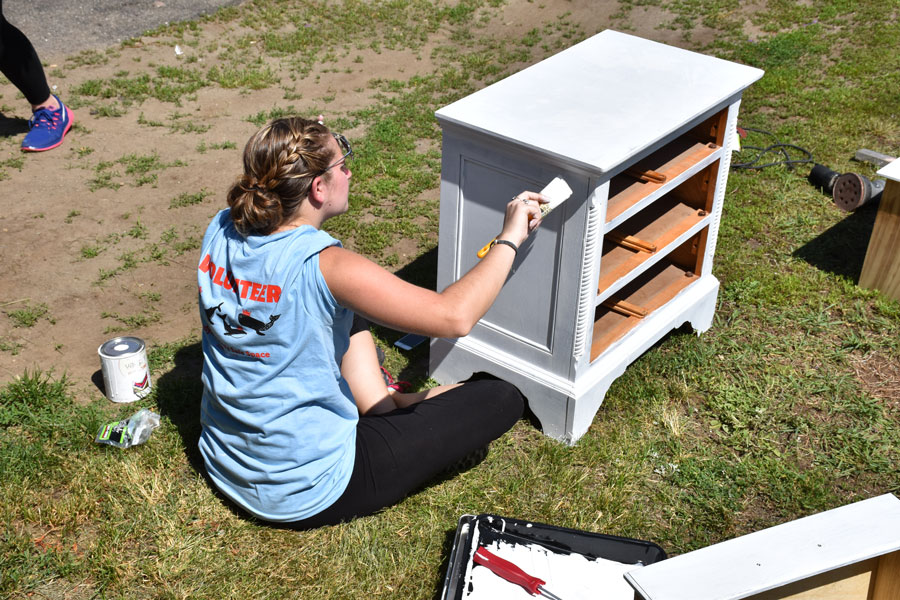 Alanna painting the nightstand -- awesome job!