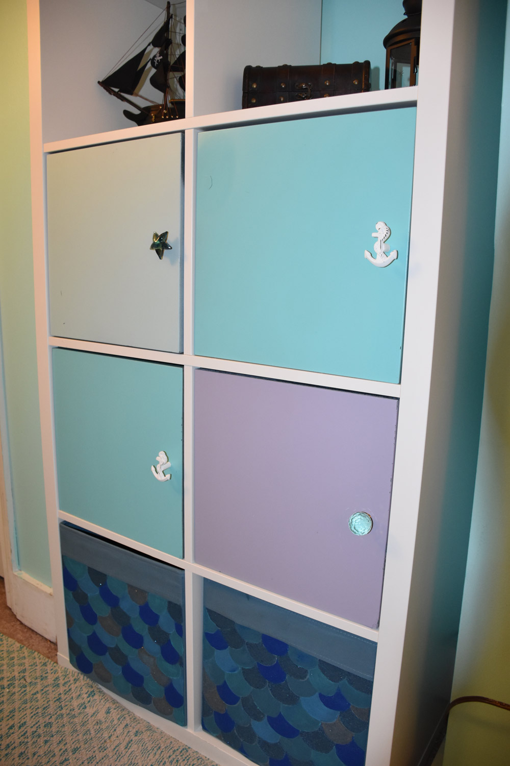  Hand-painted mermaid scaled storage bins and custom cabinet knobs 