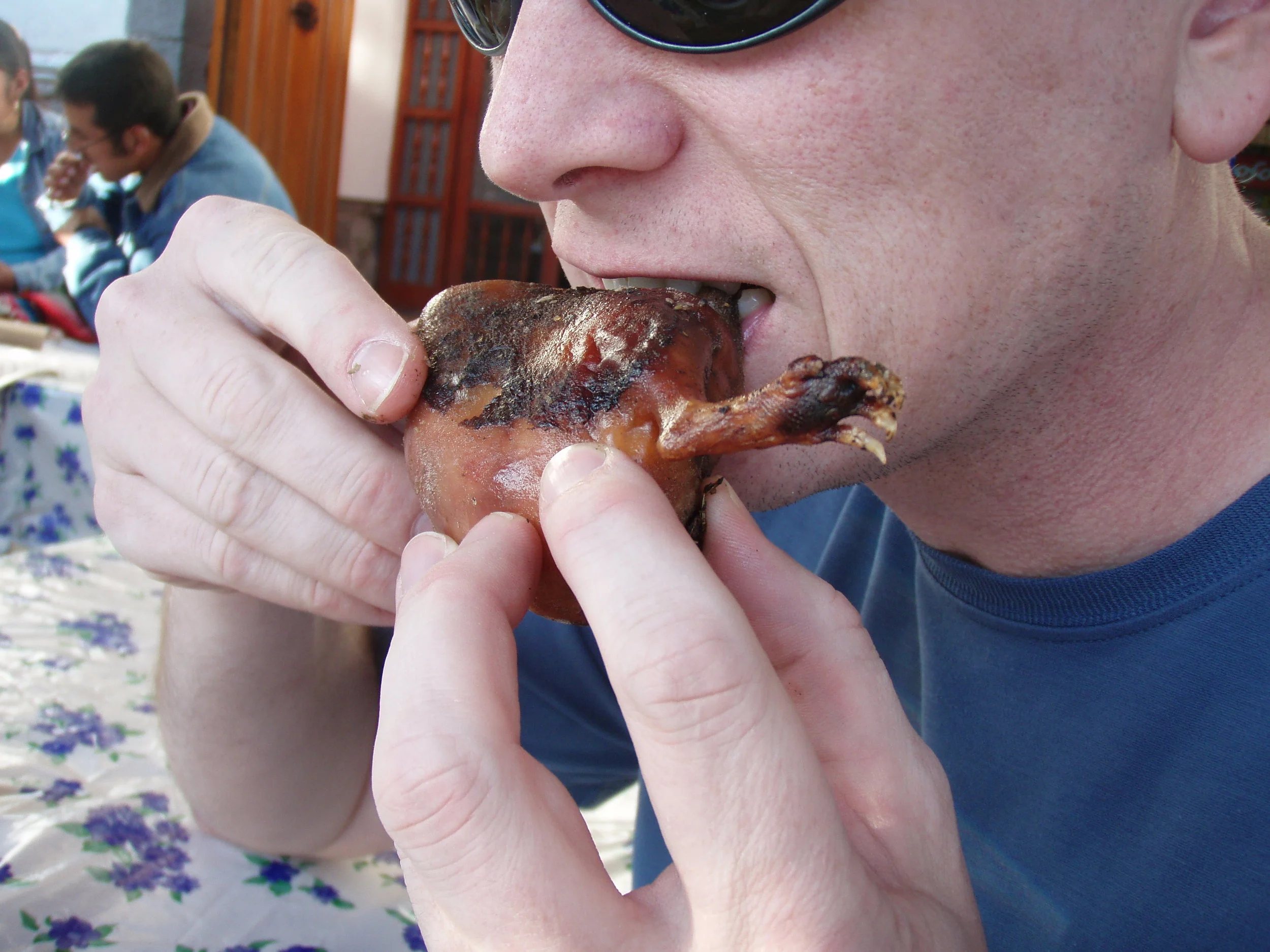 Gary trying cuy in Peru