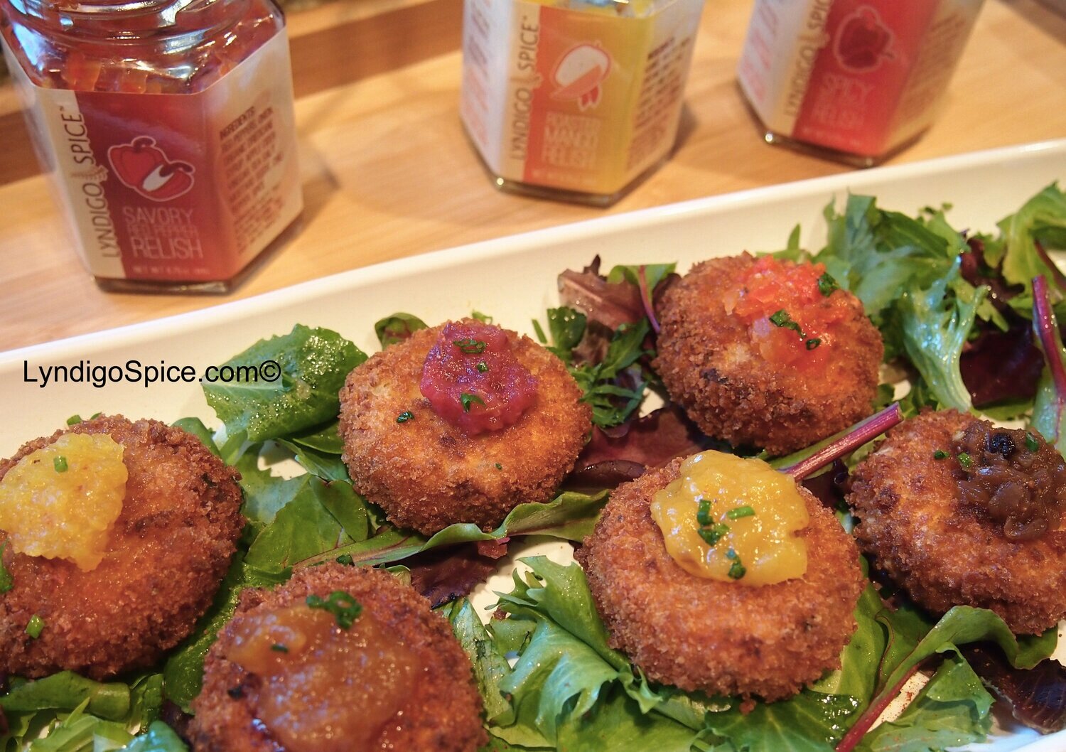 Salmon Cakes topped with Lyndigo Spice® assorted Relishes and Chutneys