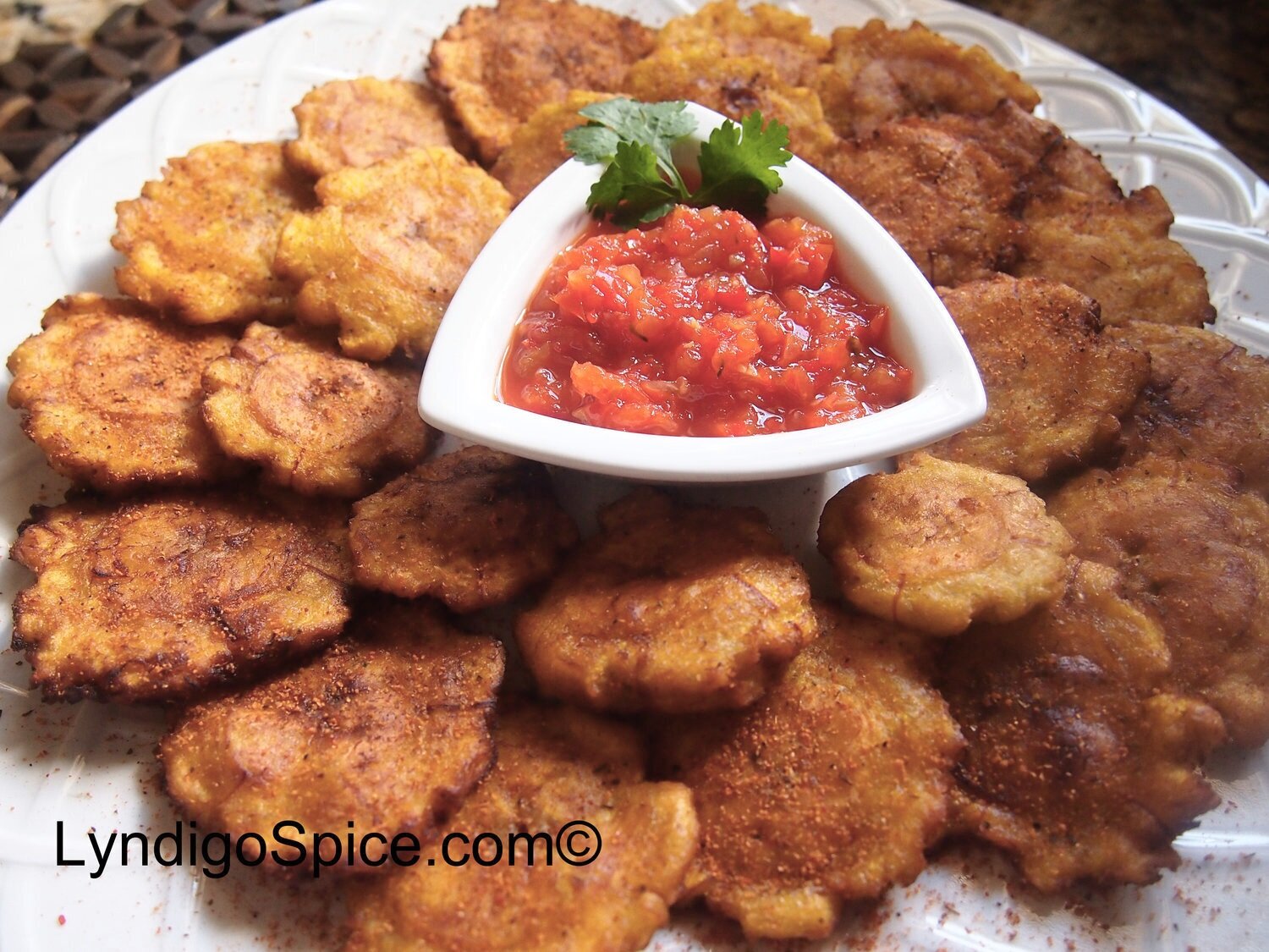Tostones seasoned with Original Spice Rub and Spicy Red Pepper Relish for dipping.