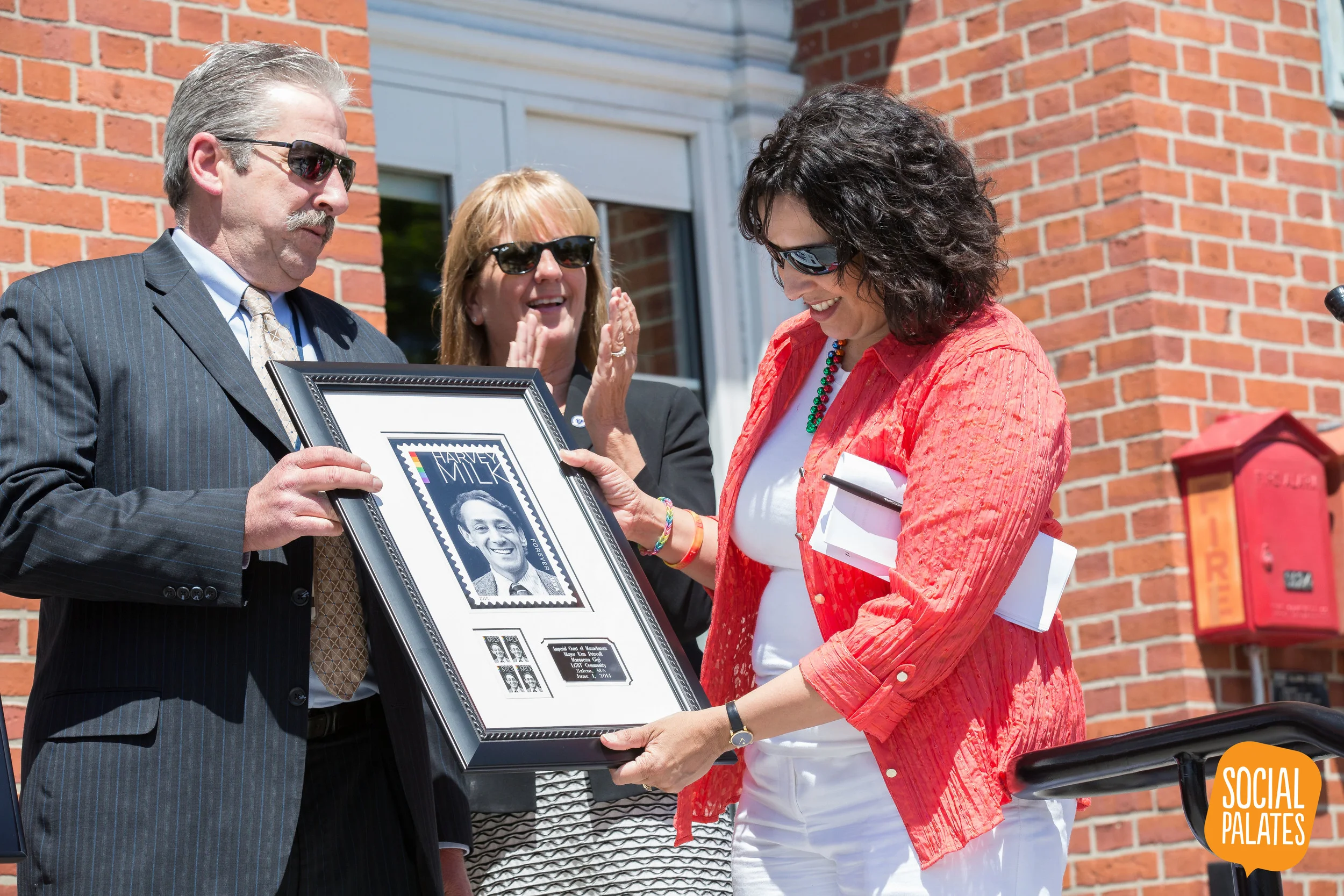 A smaller framed copy of the Harvey Milk Forever Stamp & plaque commemorating the event was given to Mayor Driscoll to be hung in City Hall. Photo © 2014 John Andrews of Social Palates Photography