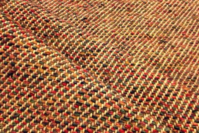 A change of weft from the golden threads in the previous image to the vibrant fall colors here make a world of different even though the two color palettes are similarly focused on yellow, orange, and blue.