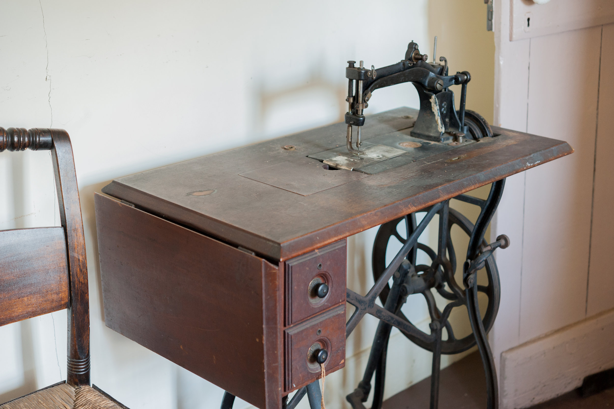 The sewing machine in the grandmother's room was controlled by the iron wheel and foot pedal. (Copy)