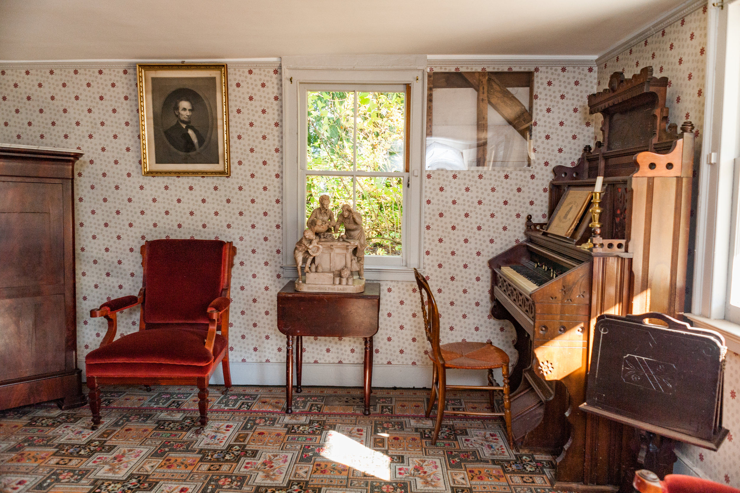 A sample of the wood frame of the original house was left exposed and can be seen above the organ. (Copy)