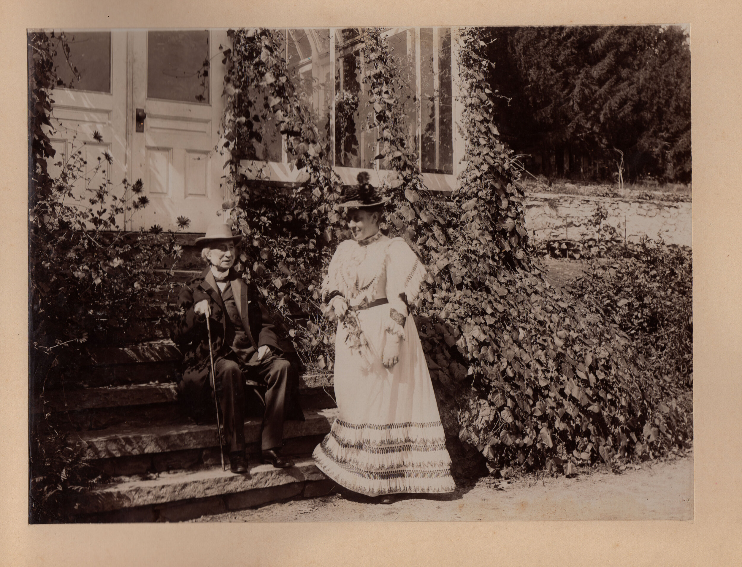 Emily and Charles on the stairs to their house