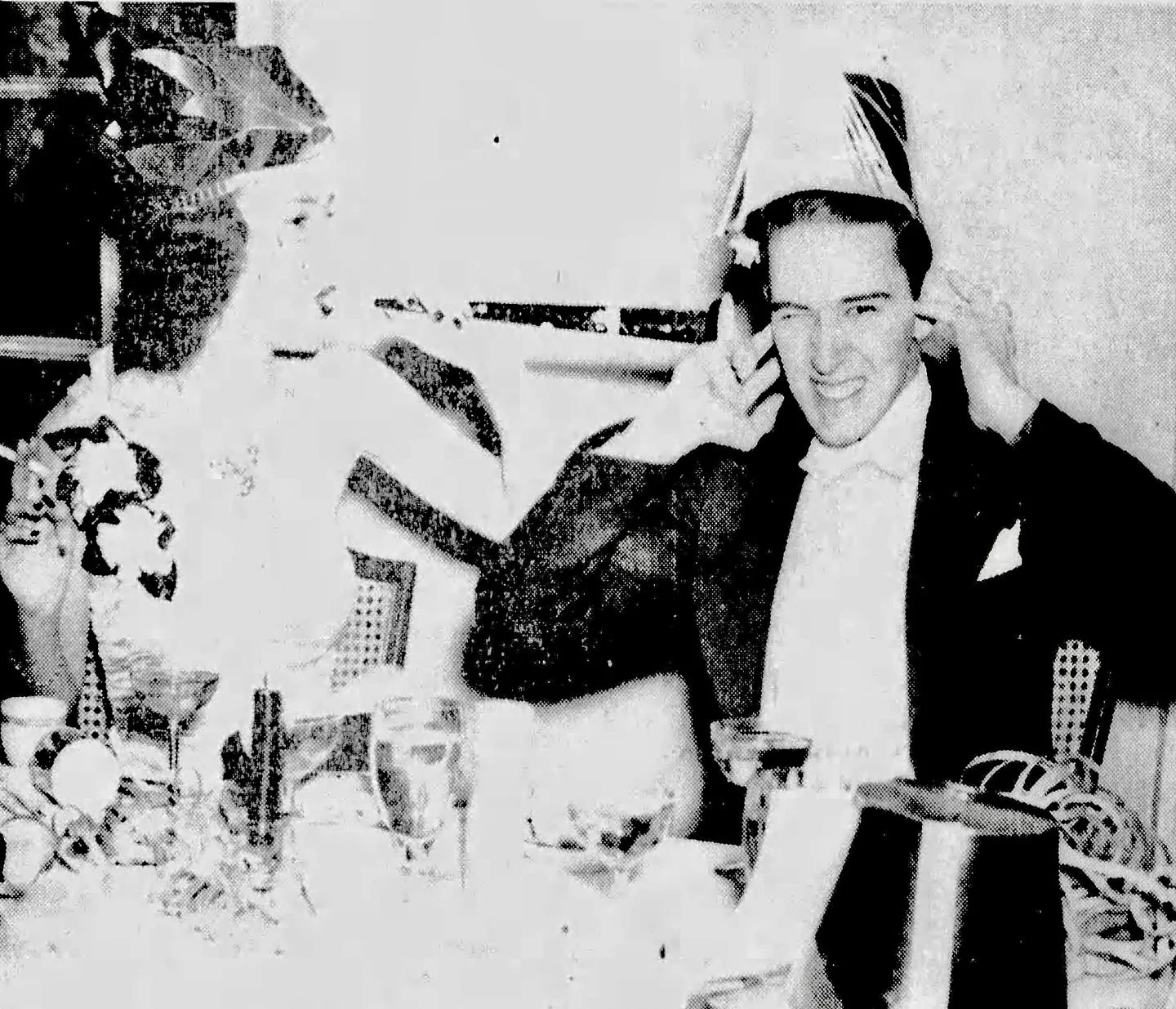 Frank C. Whitesell wishes he had earmuffs at the Scarsdale Golf Club new year&rsquo;s fete on December 31, 1939. The hornblower is Betty MacDaniel, of 61 Greenacres Avenue. He grew up at 146 Brewster Rd.

The couple married 9 months later at @hitchco