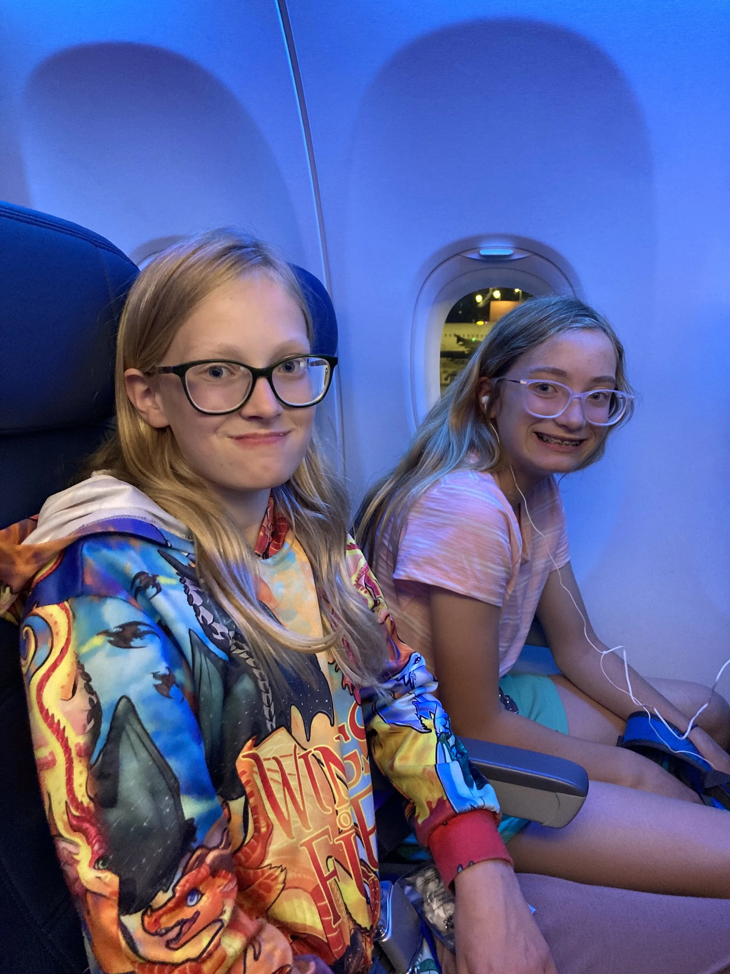  On the plane to Seattle. We didn’t fly straight to Victoria or Vancouver because plane tickets were much more expensive. Also, you only need a birth certificate to cross the border by land or sea, but you need an actual passport to cross by air, so 