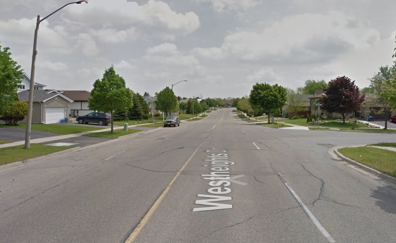 The width already exists to add bike lanes to most suburban streets. This street rarely sees levels of traffic that necessitate four lanes.